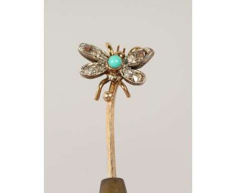 A DIAMOND SET BUTTERFLY TIE PIN, cased.
