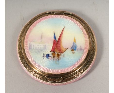 A SILVER AND ENAMEL CIRCULAR COMPACT the lid fitted with a scene of Venice. London 1928, 2ins diameter.