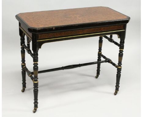 AN AESTHETIC MOVEMENT GILLOW &amp; CO. RECTANGULAR FOLDING AND SWIVEL TOP CARD TABLE, with c legs, gilded, tapering legs with