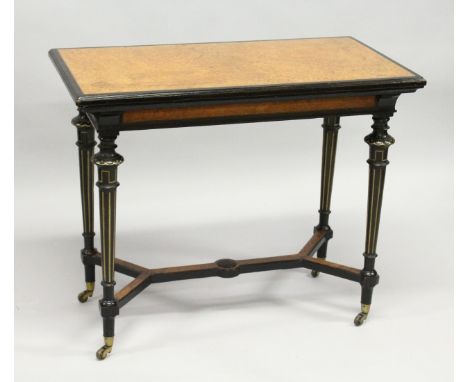 AN AESTHETIC MOVEMENT GILLOW &amp; CO. RECTANGULAR FOLDING SWIVEL TOP CARD TABLE, with amboyna legs, gilded tapering legs wit