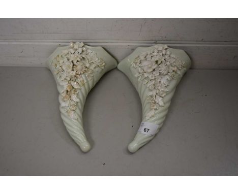 PAIR OF CERAMIC WALL POCKETS WITH APPLIED WHITE FLORAL DECORATION
