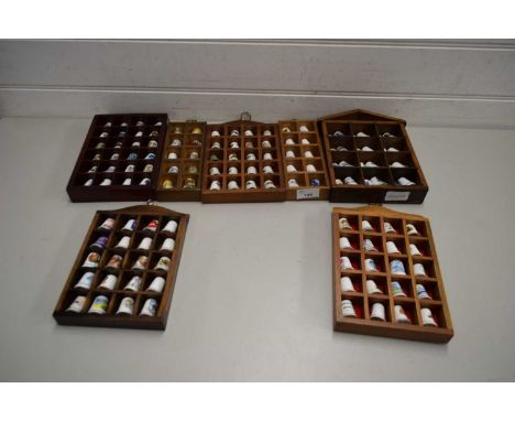 QUANTITY OF CERAMIC THIMBLES IN CUSTOM MADE WOODEN DISPLAY CABINETS
