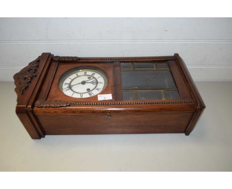 MAHOGANY WALL CLOCK WITH RELIEF MOULDED DECORATION, WHITE ENAMEL DIAL WITH ROMAN NUMERALS