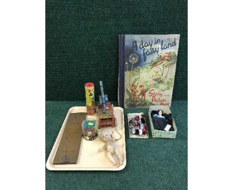 A tray of keliedoscope, rubix cube, wooden cribbage board, mid twentieth century pull-along Donald duck, together with one vo