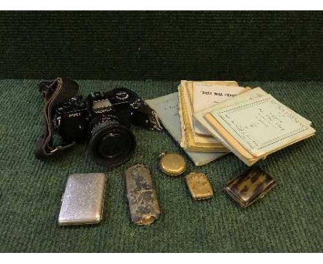 A basket containing Yashica FR1 camera, tortoiseshell cigarette case, vesta box, stirrup cup in case together with a small qu