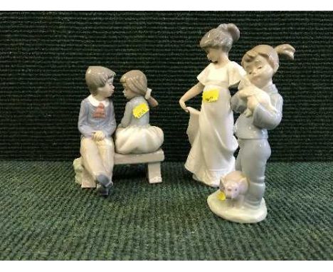 Three Nao figures - Girl in white dress, Girl with lamb together with boy and girl on bench