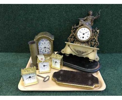 A tray of continental brass and marble mantle clock with key, four battery powered clocks, a brass shell casing