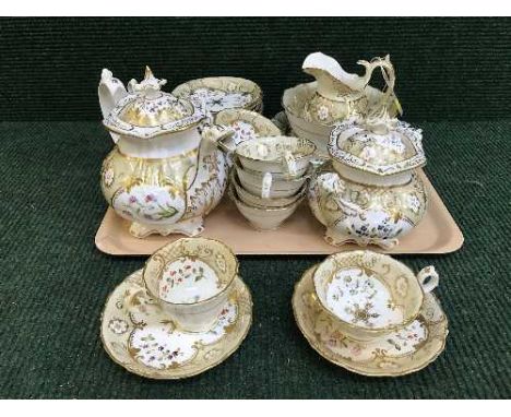 A tray of thirty piece Victorian cream and gilt tea service 