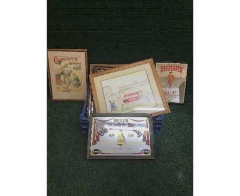 A box of seven framed pictures including Cadbury's and Jacobs advertising, three watercolours depicting rabbits and Bells Sco