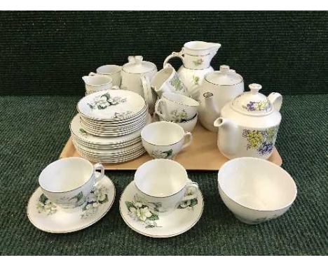 A tray of English pottery tea service, bone china jug, Ringtons floral trellis teapot, milk jug and sugar basin
