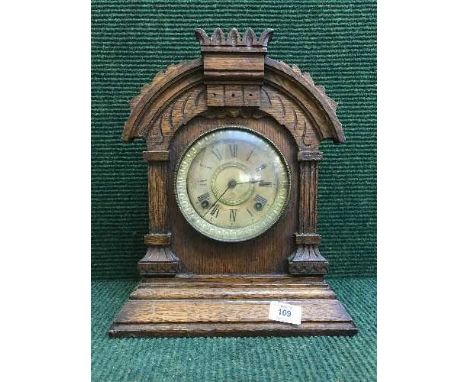 An oak late nineteenth century American mantle clock by Ansonia Clock company New York
