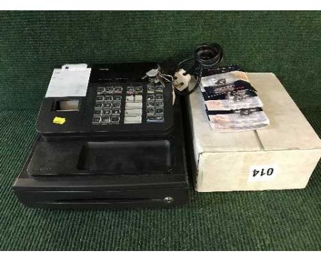 A Casio 140 CR cash register with keys together with a quantity of till rolls and ink rollers 
