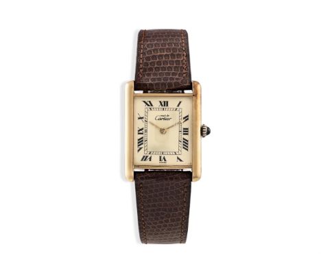 A GENTLEMAN'S GOLD PLATED MANUAL WIND TANK WRISTWATCH, BY CARTIER, CIRCA 1980The 17-jewel manual wind movement, cream dial wi