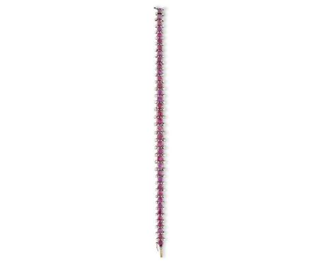 A RUBY AND DIAMOND BRACELETComposed of a graduated line of circular-cut rubies, each highlighted with round brilliant-cut dia