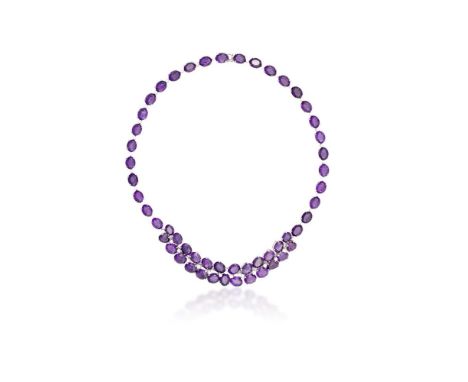 AN AMETHYST AND DIAMOND NECKLACE WITH BRACELET SUITESet throughout with oval-shaped amethysts, each interspersed by round bri