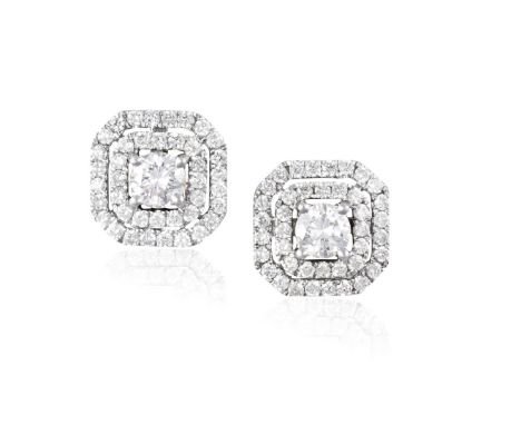A PAIR OF DIAMOND EARSTUDSEach round brilliant-cut diamond, in a four-claw setting, between a double pierced surround of simi