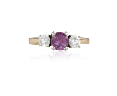 A RUBY AND DIAMOND RINGThe cushion-shaped ruby, within a four-claw setting, between two brilliant-cut diamond shoulders, moun