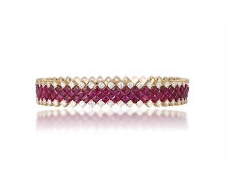A RUBY AND DIAMOND BRACELETThe highly articulated bracelet set with three rows of square-cut rubies, within a border of round
