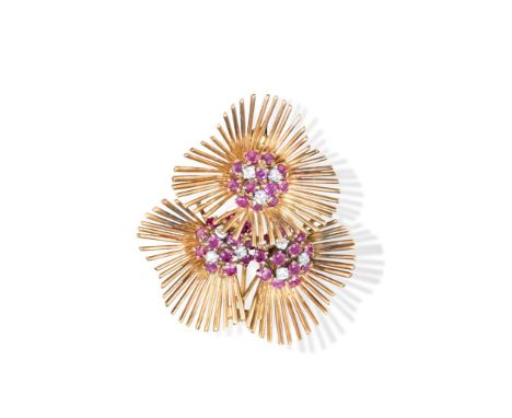 A RUBY AND DIAMOND FLOWER BROOCH, CIRCA 1965The trio circular-cut diamond and ruby stamens, each within a border of petals co