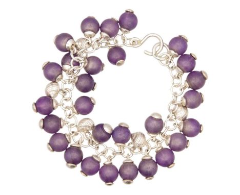 FAY PAGE, ISLES OF SCILLY - A silver and amethyst bead set bracelet. The oval links applied with silver Winkle shell cast bea