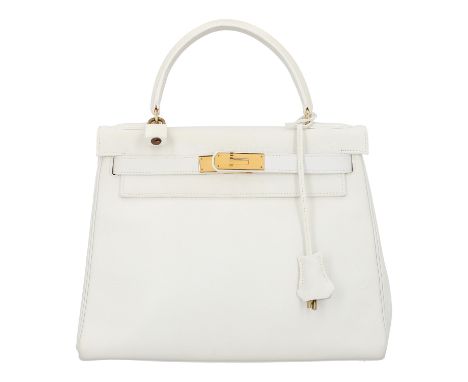 HERMÈS VINTAGE Hantasche "KELLY BAG 28", Koll. 1986. Fein genarbtes Leder in Weiß mit goldfarbener Hardware. Klassisches Mode
