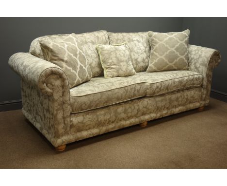 Three seater sofa (L225cm) and matching armchair (115cm), upholstered in a beige fabric with a floral pattern, turned support