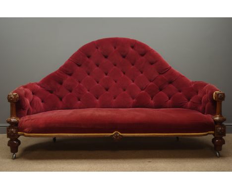 Victorian walnut framed high back sofa, upholstered in red velvet fabric with deep buttons and golden trim, carved and reeded