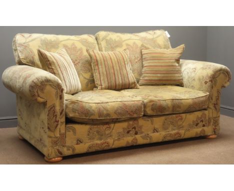 Two seat sofa, (W200cm, D107cm) matching armchair, (W109cm, D96cm) and footstool, upholstered in beige fabric, floral pattern