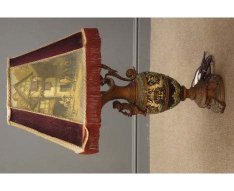 Large Italian gilt metal and moulded pottery table lamp in the form of a cherub mounted ewer with window lit shade, H101cm ov