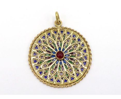 A French 18 carat gold and plique a jour enamel pendant, designed as a stained glass 'rose' window in the French Gothic manne