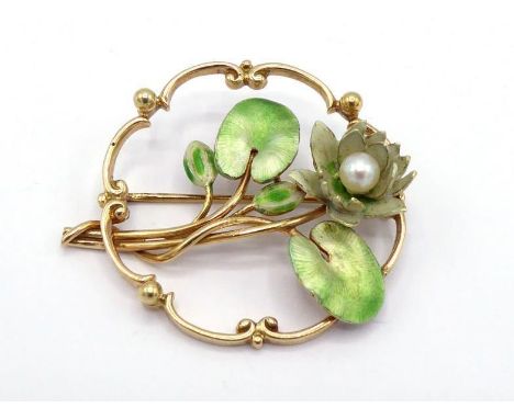 A 14 carat gold, enamel and cultured pearl brooch, the enamel and pearl waterlily design within a  scrolling openwork frame, 