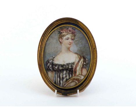 An oval porcelain plaque painted in oils with a half length  portrait of Princess Charlotte, the reverse of the beaded gilt f
