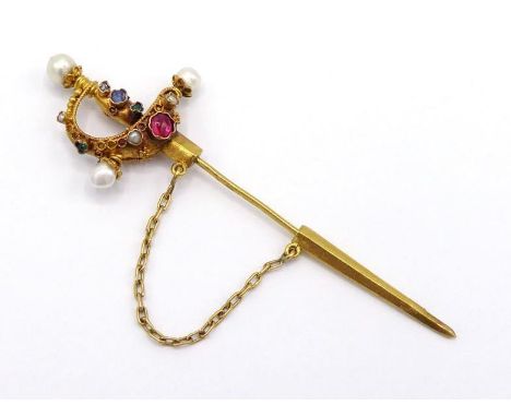 A late 19th century gold and gem set stick pin, circa 1890, modelled as a cup hilted rapier in the Spanish style, the hilt se