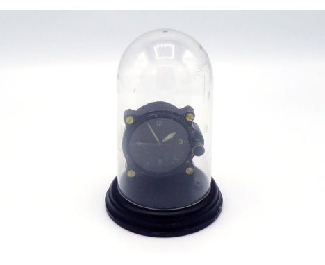 A WWII Air Ministry aircraft instrument panel mounting eight day clock, the black dial with luminous markings and hands, incl