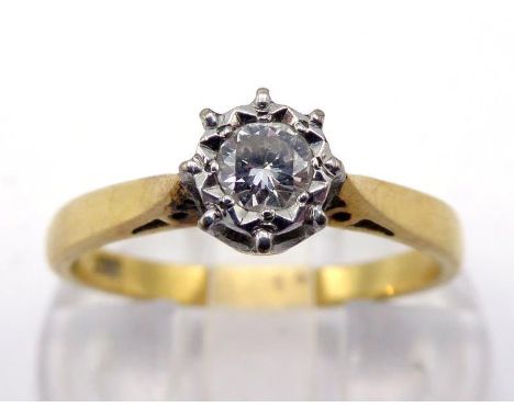 A single stone diamond ring, the round brilliant approx.. 0.15 carat, illusion set, the yellow metal shank stamped ‘18ct’, fi