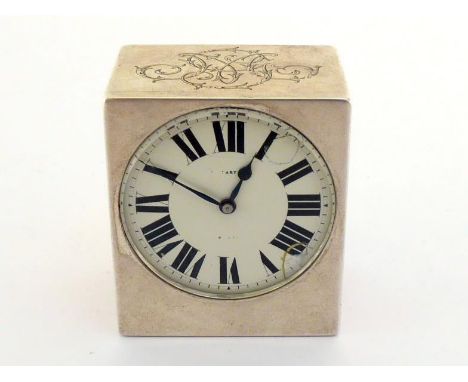 A French silver boudoir clock made for Tiffany, circa 1910, plain oblong form with white enamel dial marked "TIFFANY", black 