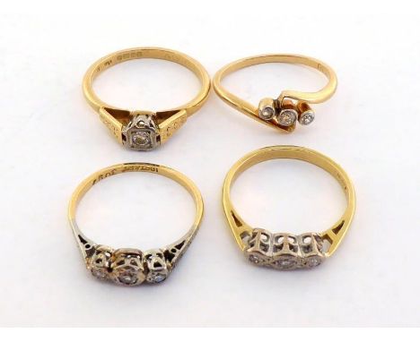 A group of four diamond rings, three of the rings illusion set,  three stamped "18 ct" and the other fully hallmarked as 18 c