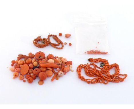 A mixed lot of fashioned and faceted loose coral beads, approx. 58gms (VAT will be charged on the hammer of this lot) 