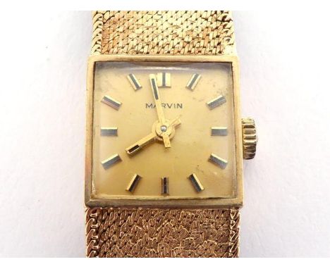 A 9 carat gold lady's wristwatch, the square gilt dial with baton numerals and hands, and 17 jewel manual wind movement, to i