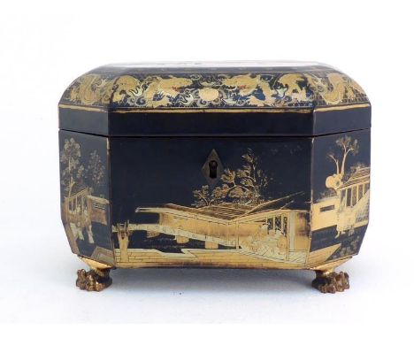 A Japanese lacquered wood tea caddy box on carved paw feet, decorated with black lacquer, gilt-painted landscape and figures 