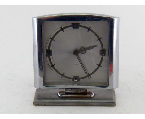 A 1930s chromium plated eight day mantel clock, the silver coloured face with chrome numerals and batons. 12cm. high. 