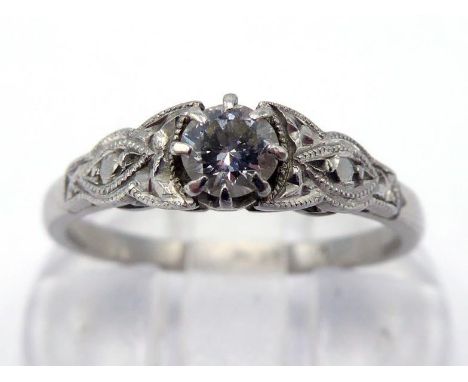 An early 20th century single stone diamond ring, circa 1920, the round brilliant approx.. 0.20 carat, to illusion cut shoulde