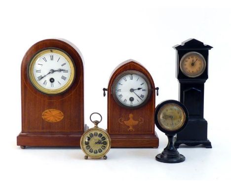 An Edwardian domed mahogany cased clock, the case on ball feet with inlaid patera and stringing, the pendulum movement with e