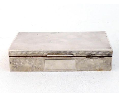 A silver engine-turned cigarette box by Mappin & Webb, Birmingham, 1962, plain rectangular reserve at front, cedarwood-lined,