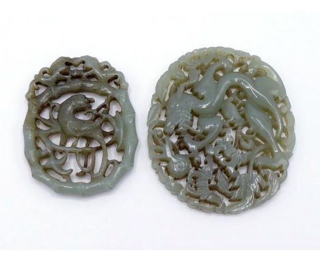 Two Chinese celadon jade oval plaques, one carved and pierced as a dragon chasing a flaming pearl among scrolling flowers; th