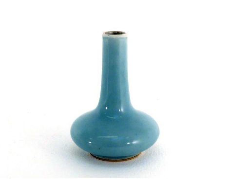 A Chinese sky-blue glazed porcelain vase, compressed circular with tapering cylindrical neck, Kangxi mark to the base, 19th c