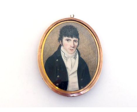 English School, circa 1800. A portrait miniature of a gentleman with curly black hair, dark blue coat, white waistcoat and sp