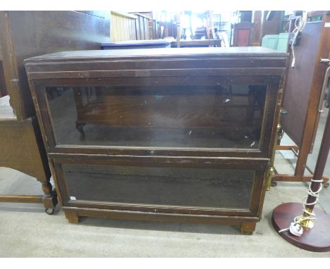 A Globe Werneke oak two tier sectional stacking bookcase