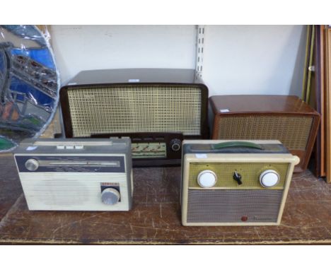 A vintage Bakelite radio and three others