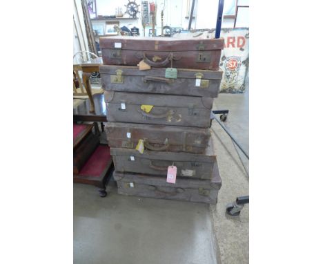 Six vintage brown leather suit cases